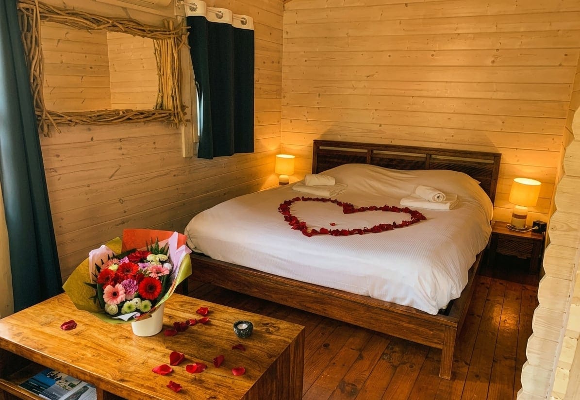 Romantic love room bedroom decorated with rose petals